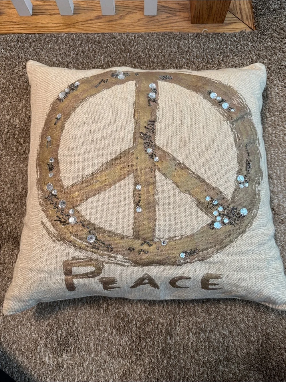 Pottery Barn Beige Pillow with Gold Peace Sign Embellishment